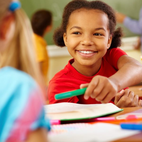 close-up-smart-little-girl-with-big-smile-scaled.jpg